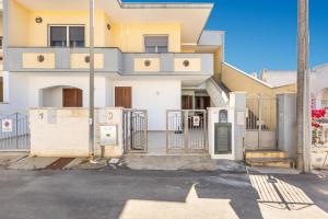 an empty street in front of a house at Casa Anja by BarbarHouse in Marina di Leuca