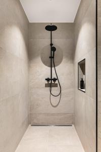 a shower in a bathroom with a wall at Odda Atmosphere in Odda +37 photos