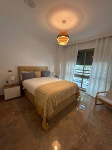 Postel nebo postele na pokoji v ubytování REGIDOR Cartagena