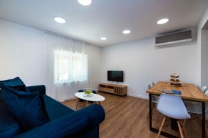 Televízia a/alebo spoločenská miestnosť v ubytovaní M&M Pelivan apartments