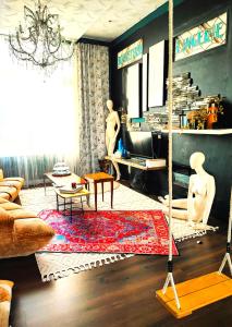 a living room with a couch and a rug at Duplex Atypique à Bruxelles in Brussels