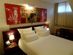 Llit o llits en una habitació de Hotel Mitra, Story Hotels