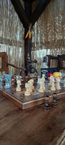 a chess board on a table in a room at Boglárka Vendégház in Morăreni +27 photos