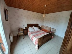 Ένα ή περισσότερα κρεβάτια σε δωμάτιο στο Location chez Choco