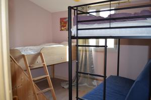 Palanda nebo palandy na pokoji v ubytování Appartement mer