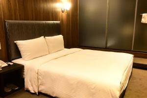 Postel nebo postele na pokoji v ubytování Meworld Hotel - Taipei Main Station