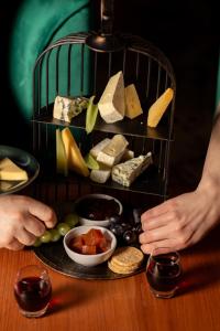a plate of cheese and other foods on a table at Moxy Edinburgh Fountainbridge in Edinburgh