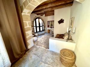 a large room with a hallway with a room with at Villa ABBA in Plaka +81 photos
