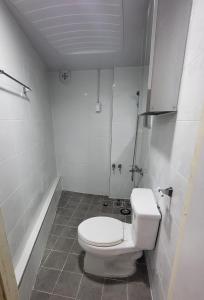 a white bathroom with a toilet and a tub at Mong House #Mangwon-dong Mangridangil 2F Private stay in Seoul
