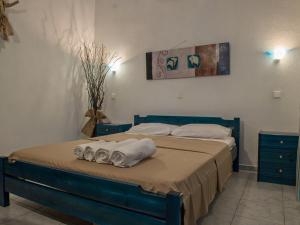 Ένα ή περισσότερα κρεβάτια σε δωμάτιο στο Toroni Dreams