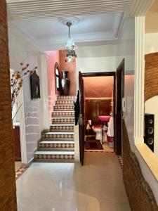 a hallway with a stairway with a staircase at Luxury duplex in the centre of Maarif in Casablanca