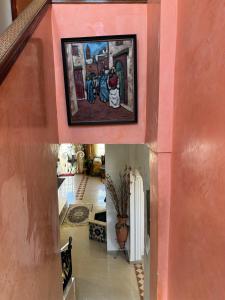 a hallway in a house with a painting on the wall at Luxury duplex in the centre of Maarif in Casablanca