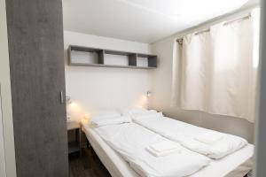 Postel nebo postele na pokoji v ubytování Bella Camping