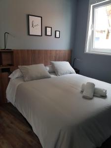 Postel nebo postele na pokoji v ubytování NOARU Apartamentos