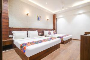 Krevet ili kreveti u jedinici u okviru objekta FabHotel Awadhvue