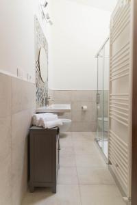 a bathroom with a sink toilet and a mirror at La casetta in Tortoreto Lido +42 photos