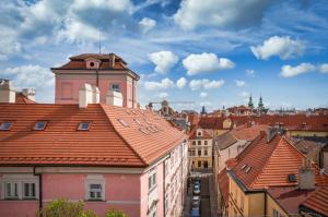 a view of a city with roofs of buildings at 3 Epoques Apartments by Adrez in Prague