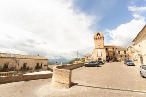 a street with a clock tower in a town at La casetta in Tortoreto Lido