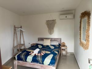 Postel nebo postele na pokoji v ubytování Surf Bali Villa