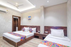 Krevet ili kreveti u jedinici u okviru objekta FabHotel Awadhvue