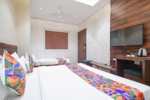Krevet ili kreveti u jedinici u okviru objekta FabHotel Awadhvue