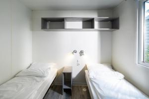 Postel nebo postele na pokoji v ubytování Bella Camping