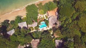 an aerial view of a house with a swimming pool at Koh Jum Resort in Ko Jum