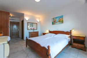 Postel nebo postele na pokoji v ubytování Adria Brela Apartments