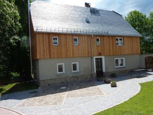 a large house with a gambrel roof at Hilma in the holiday home Bero in Bärenwalde