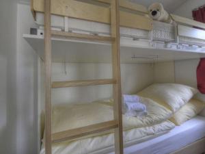 a room with two bunk beds with towels on them at Seemöwe "Seagull" F178 in Fehmarn +15 photos