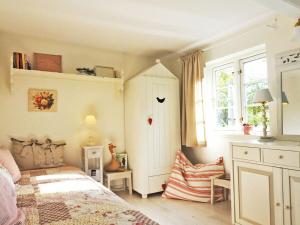 Ένα ή περισσότερα κρεβάτια σε δωμάτιο στο Hasenhaus Comfortable holiday residence
