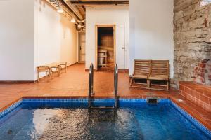 a pool in the middle of a room at 16eur - Fat Margaret's in Tallinn