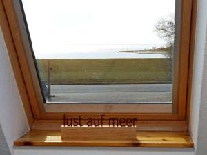 a window with the words just art meet at House in Legde "East" in Norderney