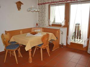 a dining room with a table and two chairs at Berghaus Oberleitner - peace and relaxation in Neureichenau