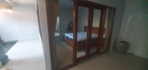 Ένα ή περισσότερα κρεβάτια σε δωμάτιο στο Tebanyoman Guesthouse