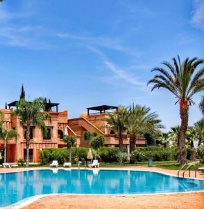 Bazén v ubytování Residence atlas golf resort nebo v jeho okolí