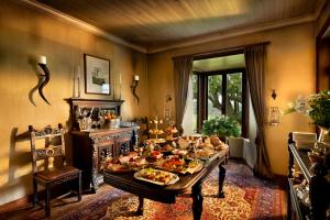a room with a table with food on it at Gorah Elephant Camp in Addo +36 photos