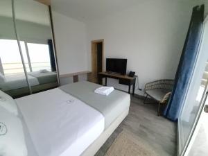 Postel nebo postele na pokoji v ubytování RM Green Hotel