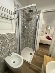 a bathroom with a shower and a sink at Garden City House in Rome