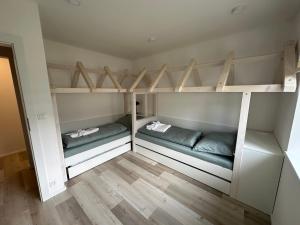 Postel nebo postele na pokoji v ubytování Apartmán Oriens Pec pod Sněžkou