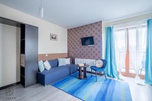 Χώρος καθιστικού στο Lazurowy Dwór - Nadmorskie Apartamenty z Basenem oraz Restauracją w Sztutowie