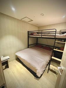 Ένα ή περισσότερα κρεβάτια σε δωμάτιο στο Maison Yongsan Myeongdon Hotel