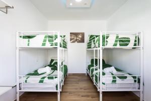 a room with three bunk beds in it at OkStay Villa Arali Lujo renovado en Tenerife in Fasnia +64 photos