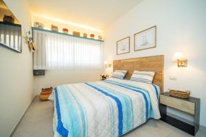 Postel nebo postele na pokoji v ubytování Residence Scoglietto 50