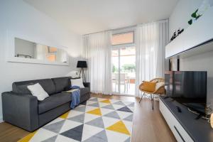 TV a/nebo společenská místnost v ubytování Residence Scoglietto 50