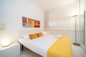 Postel nebo postele na pokoji v ubytování Residence Scoglietto 50