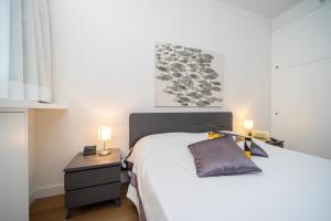 Postel nebo postele na pokoji v ubytování Residence Scoglietto 50