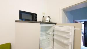 Kuchyň nebo kuchyňský kout v ubytování Apartment Grüner Fürst mit Sitzecke im Innenhof & Nähe Park & Erdgeschoss