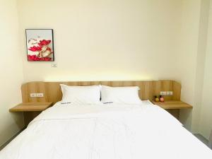 Krevet ili kreveti u jedinici u okviru objekta Penghu Roundabout Guesthouse