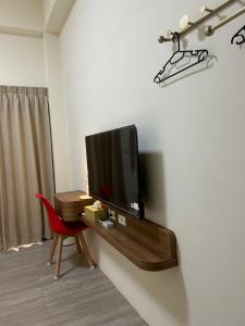 TV i/ili multimedijalni sistem u objektu Penghu Roundabout Guesthouse